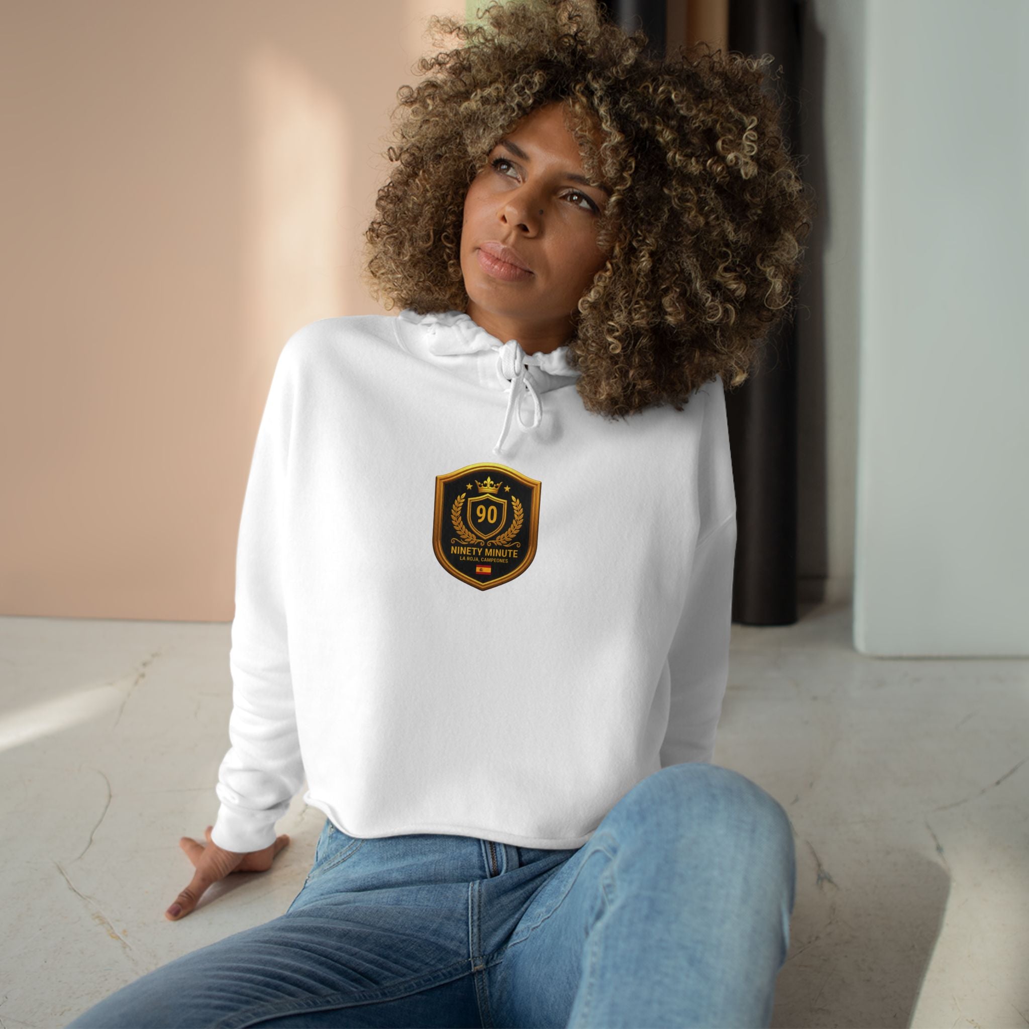 Spain Champions Crop Hoodie — Gold Shield Crest Graphic