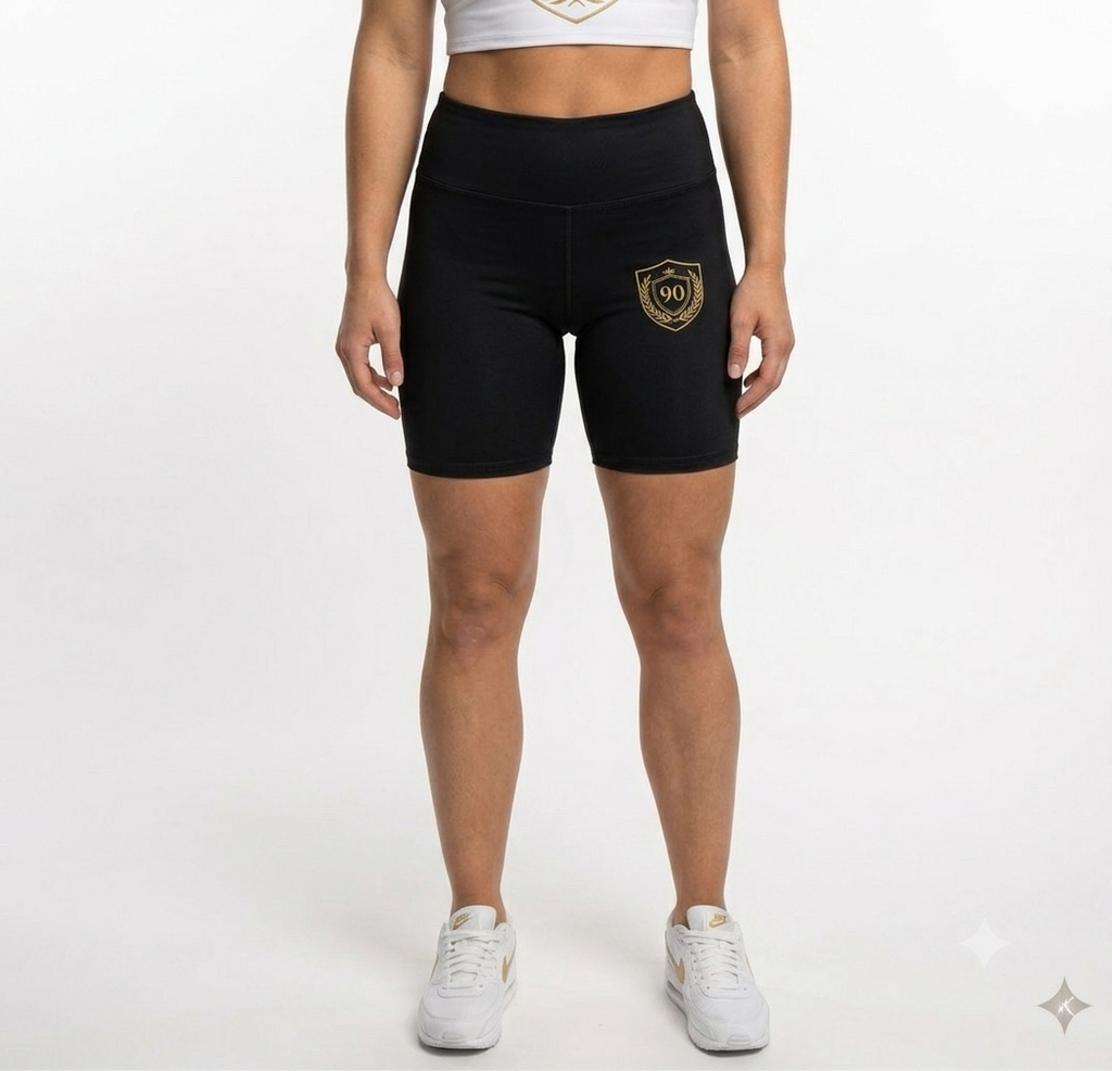 Ninety Minute | Gold Crest Logo Biker Shorts | Women’s Mid-Rise Active Shorts - Black